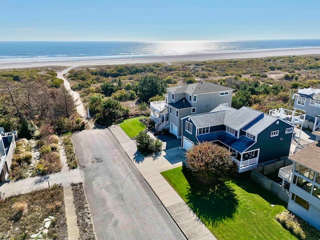 bird's eye view with a water view and a view of the beach