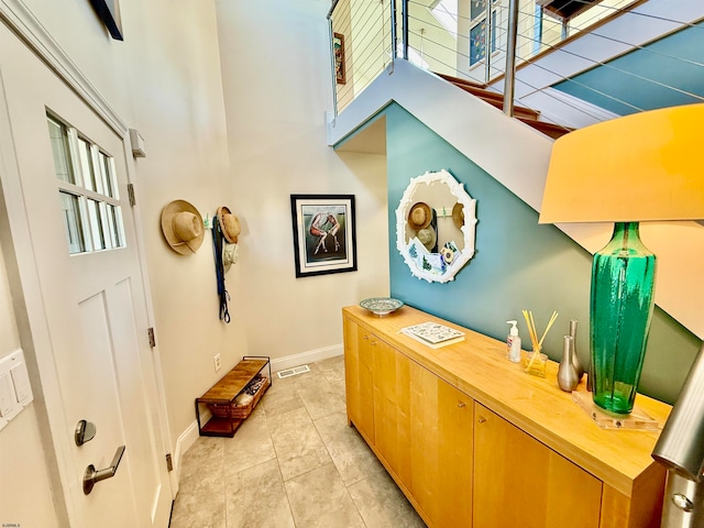 corridor featuring light tile patterned flooring