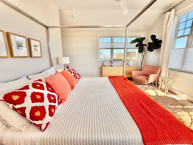 bedroom with ceiling fan and lofted ceiling