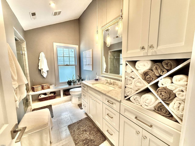 bathroom with lofted ceiling, toilet, vanity, an enclosed shower, and tile patterned floors