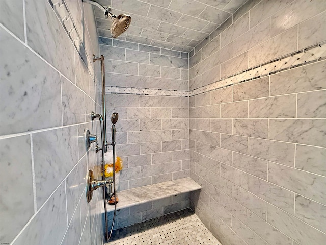 bathroom with tiled shower