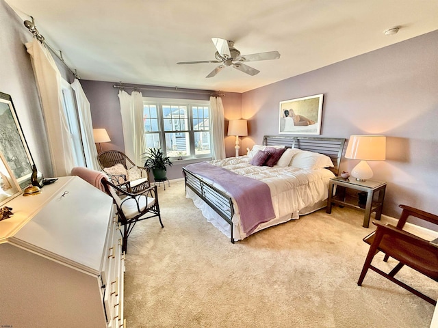 bedroom with light carpet and ceiling fan