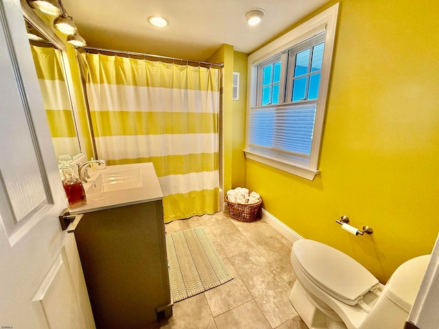 bathroom with vanity and toilet