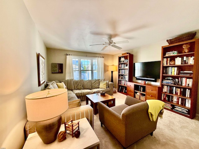 living room featuring carpet floors and ceiling fan