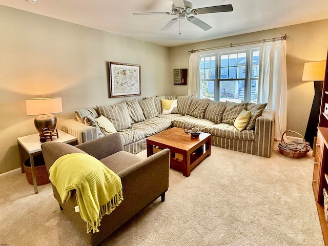 carpeted living room with ceiling fan