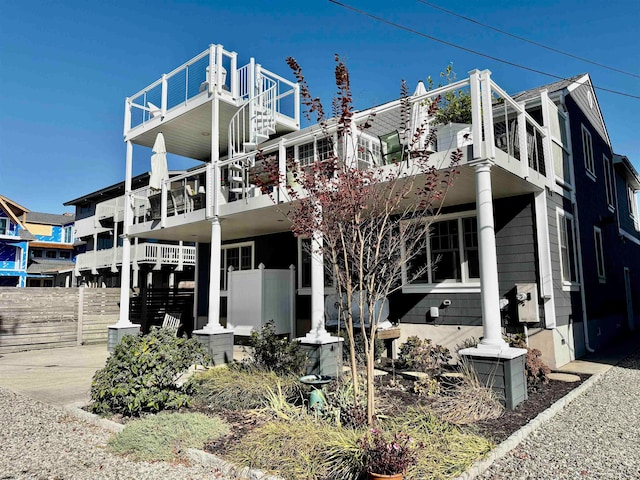 view of front of house featuring a balcony