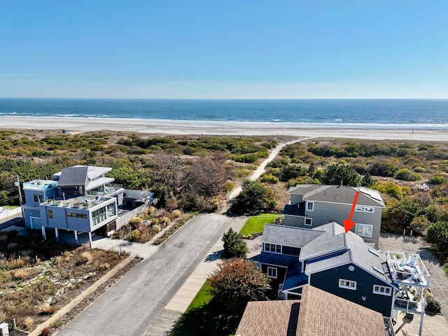 bird's eye view with a water view and a view of the beach