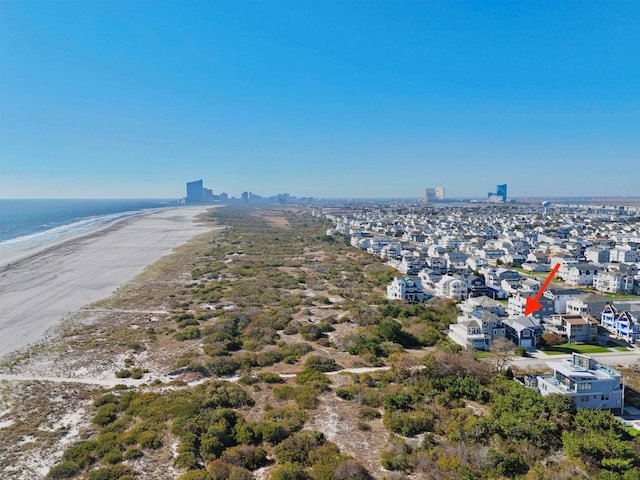 bird's eye view with a water view and a view of the beach