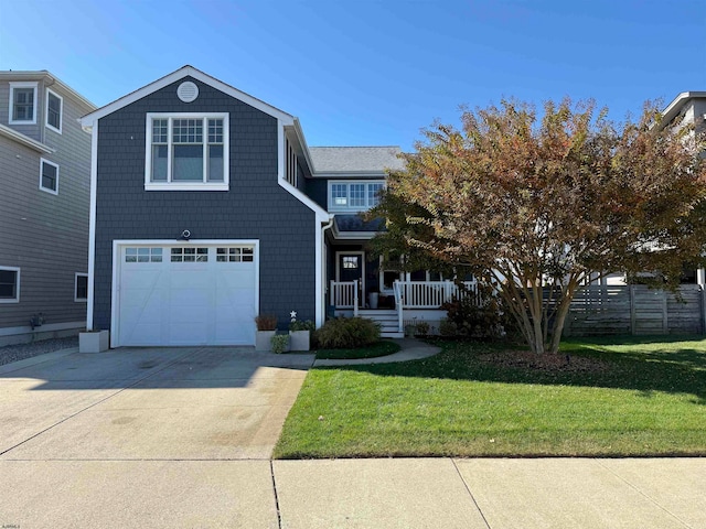 view of property with a front yard and a garage