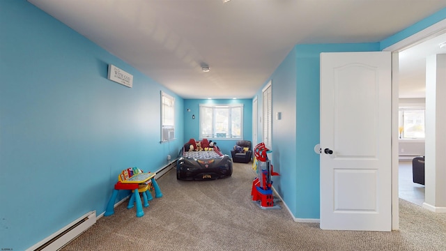 game room with baseboard heating and carpet