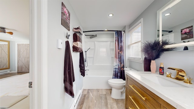 full bathroom featuring vanity, hardwood / wood-style floors, shower / bath combination with curtain, and toilet