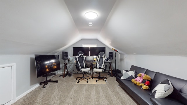 carpeted office space with lofted ceiling