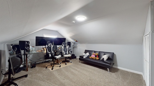 office space featuring carpet and vaulted ceiling