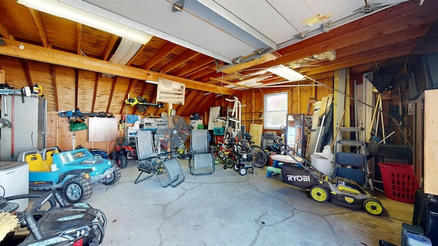 garage featuring wood walls