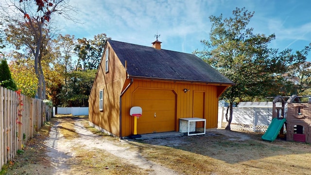 view of outbuilding featuring a playground