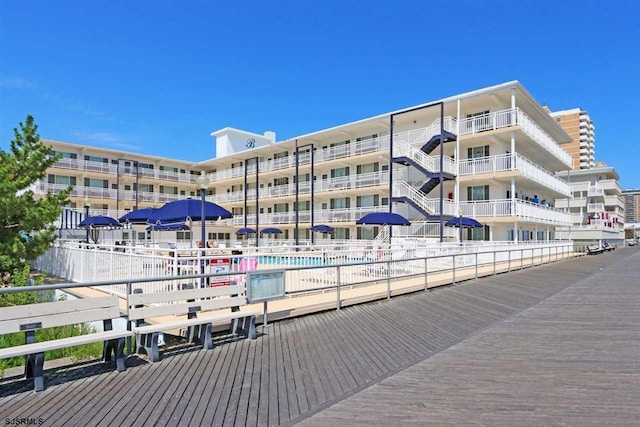 view of building exterior with a community pool