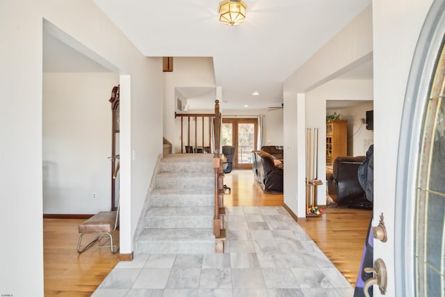 foyer featuring french doors and light wood-type flooring