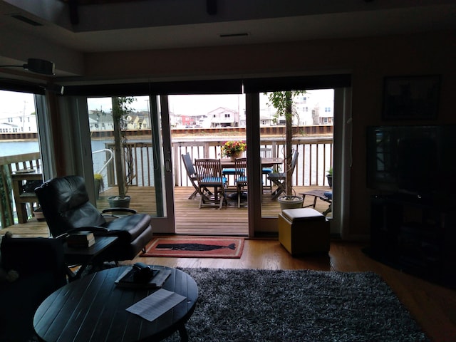 interior space featuring a water view and hardwood / wood-style flooring