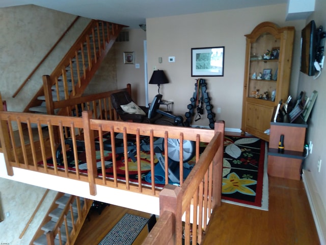 stairway featuring hardwood / wood-style flooring