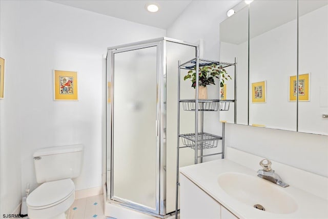 bathroom featuring vanity, toilet, tile patterned floors, and a shower with shower door