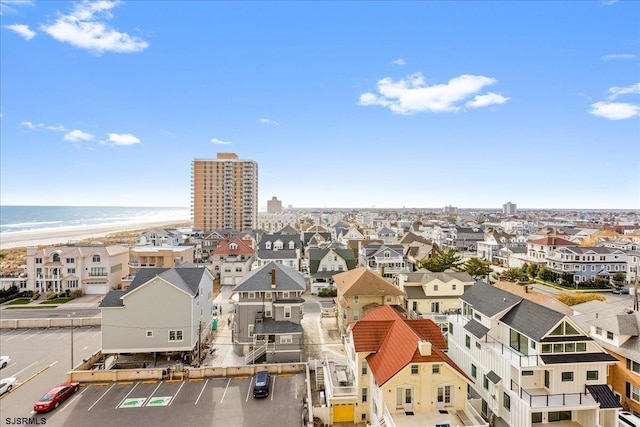 aerial view with a water view and a view of the beach