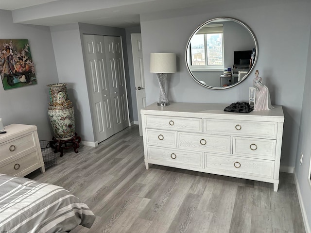 bedroom with light hardwood / wood-style flooring