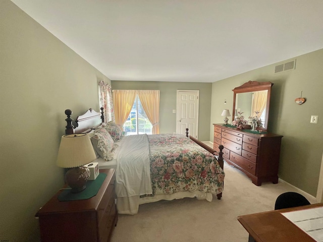 bedroom featuring light colored carpet