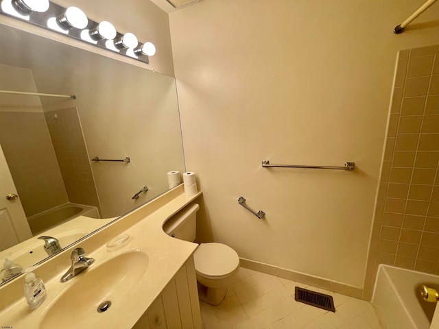 full bathroom featuring vanity, tiled shower / bath combo, toilet, and tile patterned flooring