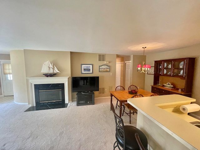 dining area featuring light colored carpet