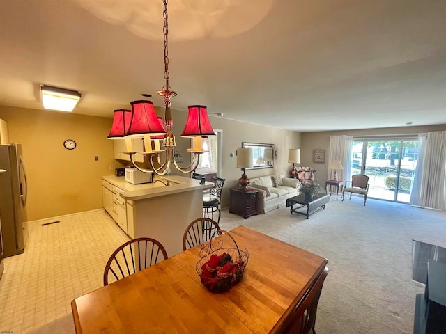 view of carpeted dining space