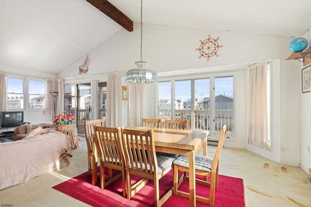 dining room with beamed ceiling, carpet floors, high vaulted ceiling, and plenty of natural light