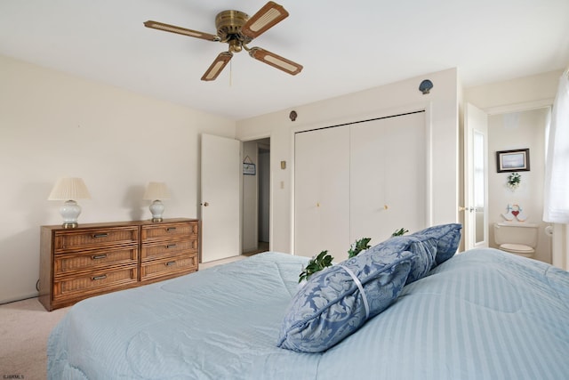 bedroom featuring a closet, ceiling fan, and light carpet