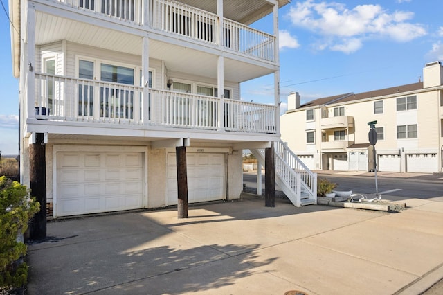 exterior space with a balcony and a garage