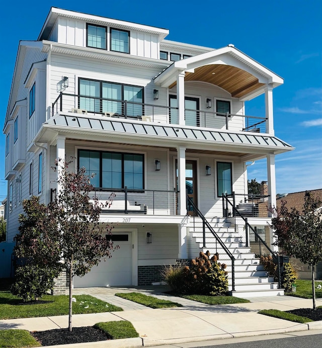 view of front of house with a garage and a balcony