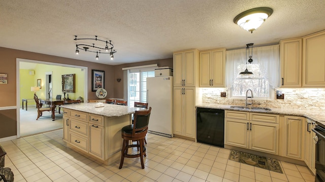 kitchen featuring hanging light fixtures, sink, black appliances, light tile patterned floors, and a textured ceiling