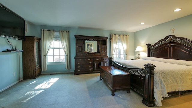 bedroom with light colored carpet