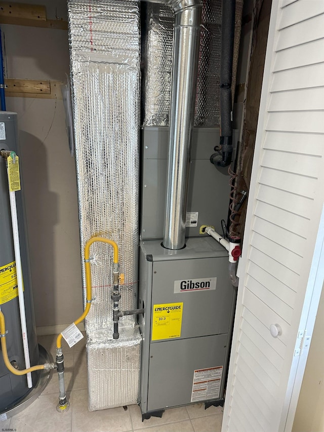 utility room featuring water heater