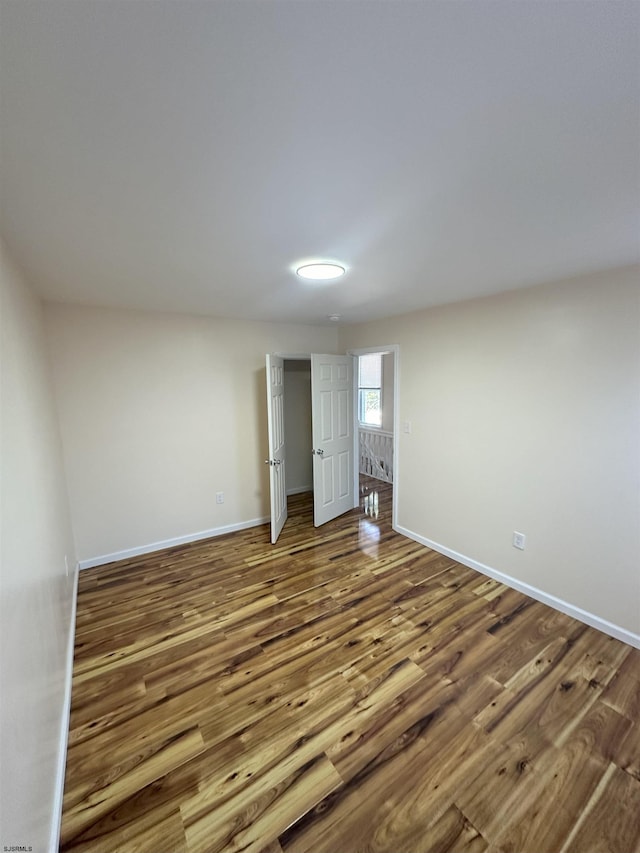 unfurnished bedroom featuring hardwood / wood-style floors