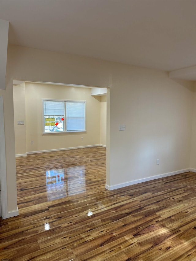 empty room with hardwood / wood-style floors