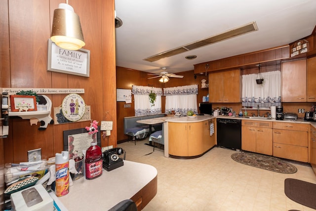 kitchen featuring black dishwasher, kitchen peninsula, hanging light fixtures, sink, and ceiling fan