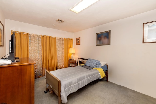 bedroom featuring light colored carpet