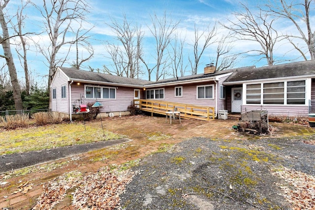 view of front of home with a wooden deck