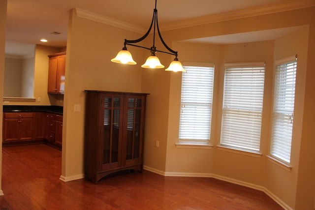 16 Primrose Cir, Egg Harbor, NJ 08234 - unfurnished dining area featuring wood finished floors, crown molding, baseboards, and plenty of natural light