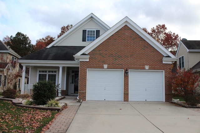 16 Primrose Cir, Egg Harbor, NJ 08234 - traditional-style home featuring concrete driveway, brick siding, a garage, and covered porch