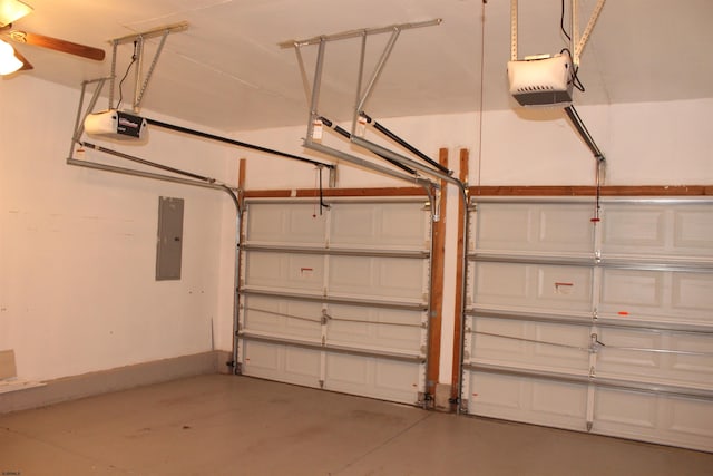 garage with ceiling fan, a garage door opener, and electric panel