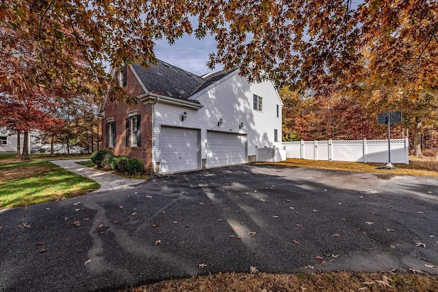 view of side of home with a garage