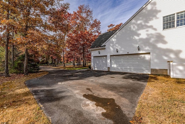 view of property exterior featuring a garage