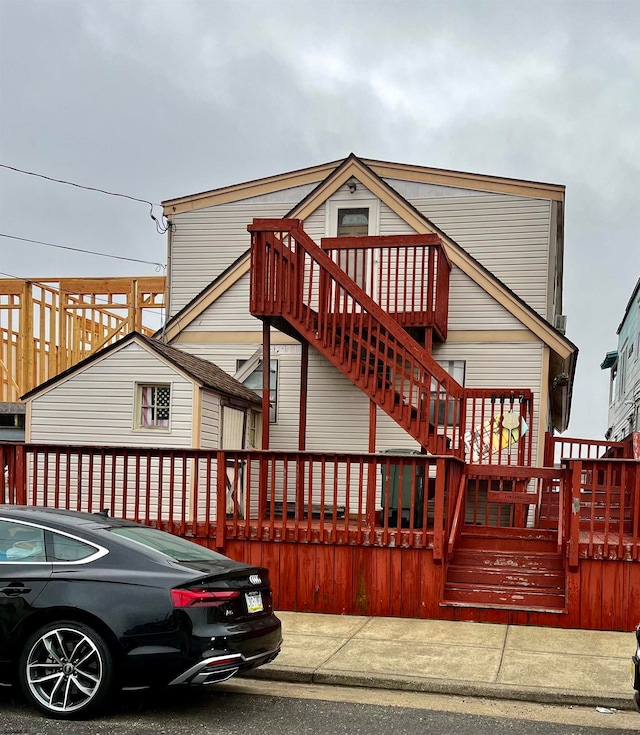 view of front of home featuring a wooden deck