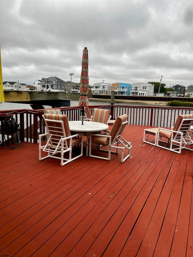 wooden deck featuring a water view