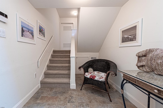 living area featuring vaulted ceiling